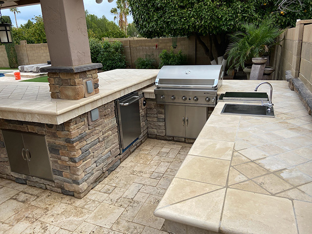 BBQ and stone counter top in backyard