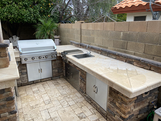 Large outdoor stone countertop with BBQ