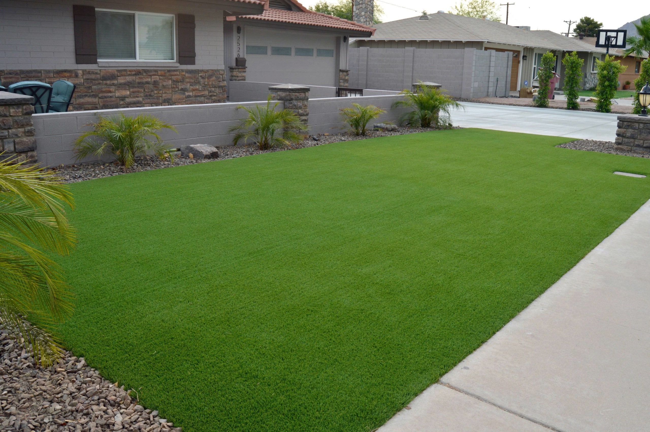 After beautiful centurion stone and artificial grass makeover in Mesa Arizona