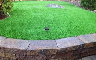 pro artificial grass with stone border arizona