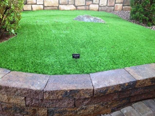 pro artificial grass with stone border arizona
