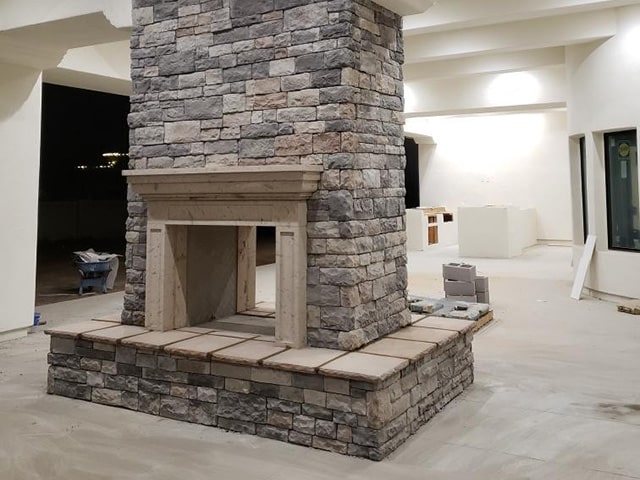 Gray stone and marble chimney design